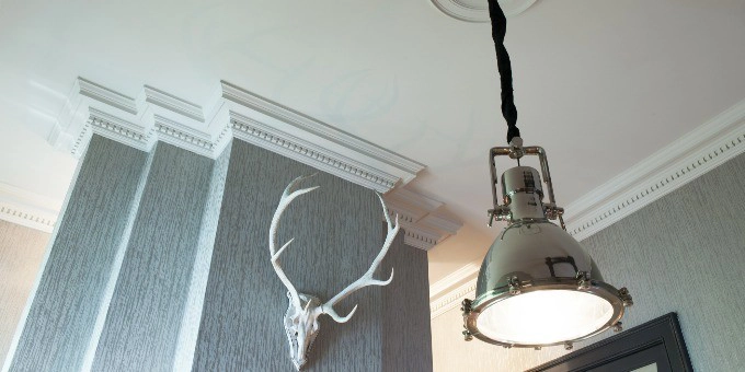 Orac Decor C422 Coving in a modern room corner with deer head and industrial pendant light