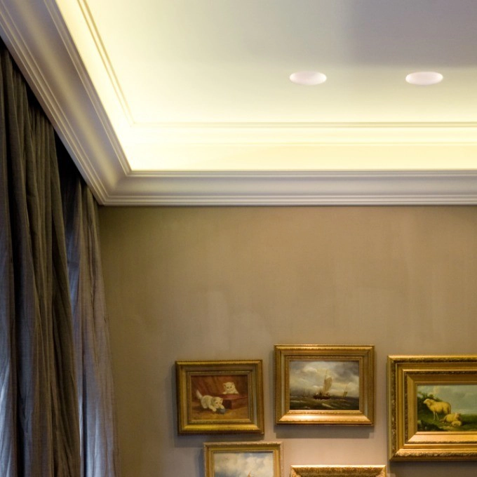Orac C333 coving installed in an elegant living room ceiling with recessed lighting