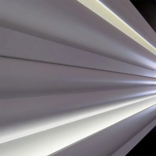 Orac P3070 panel moulding on wall beside white window blinds with filtered light