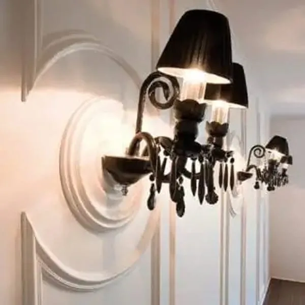 Orac R08 wall sconces on a white decorative wall with lampshades