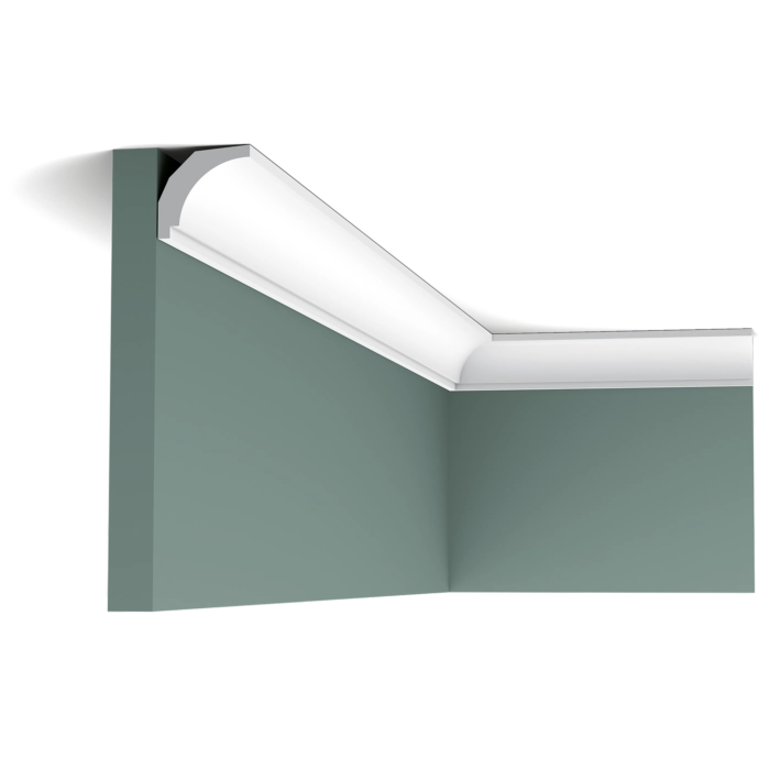 Orac CX115 coving in room corner on green walls with white ceiling