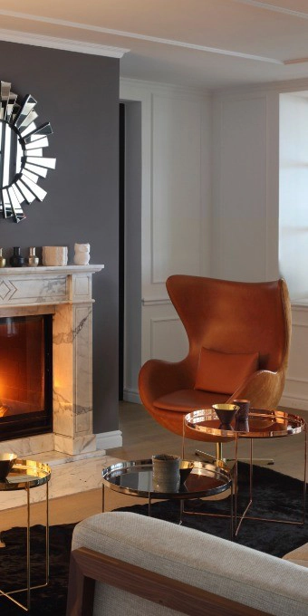 Orac Decor CX124 coving in a modern living room corner with fireplace and orange armchair