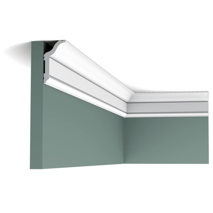 Orac CX141 coving fitted at a green wall and ceiling corner, showing the decorative profile in place