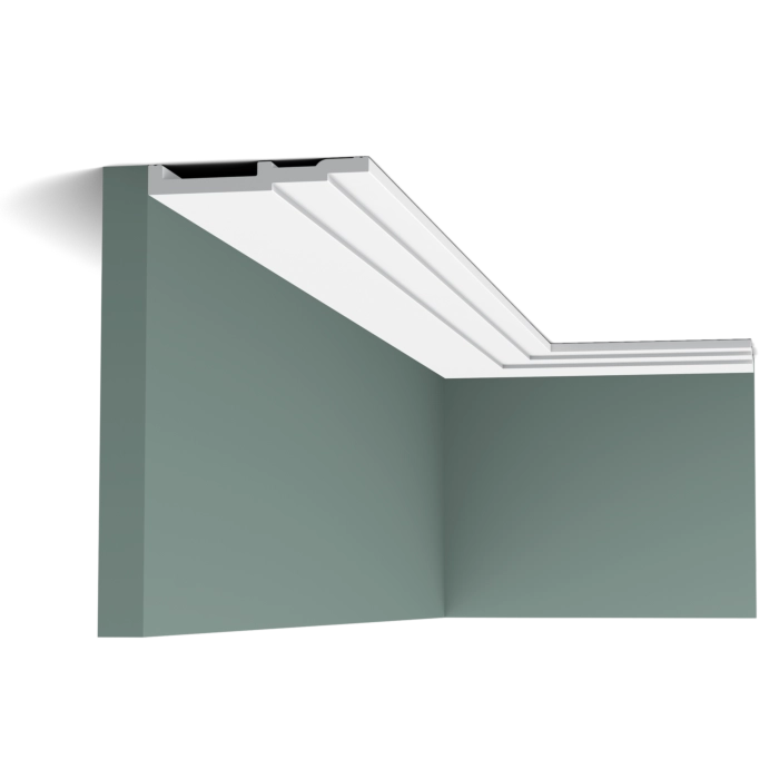 Orac Decor SX180 coving in a room corner on a green wall with white ceiling edge