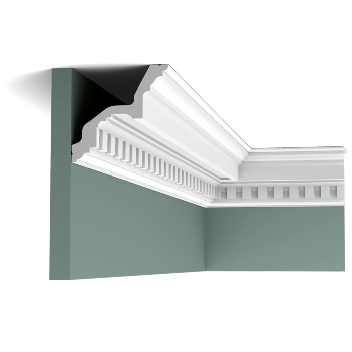 Orac Decor C211 Coving in a room corner on a green wall, showing the profile installed at the ceiling line