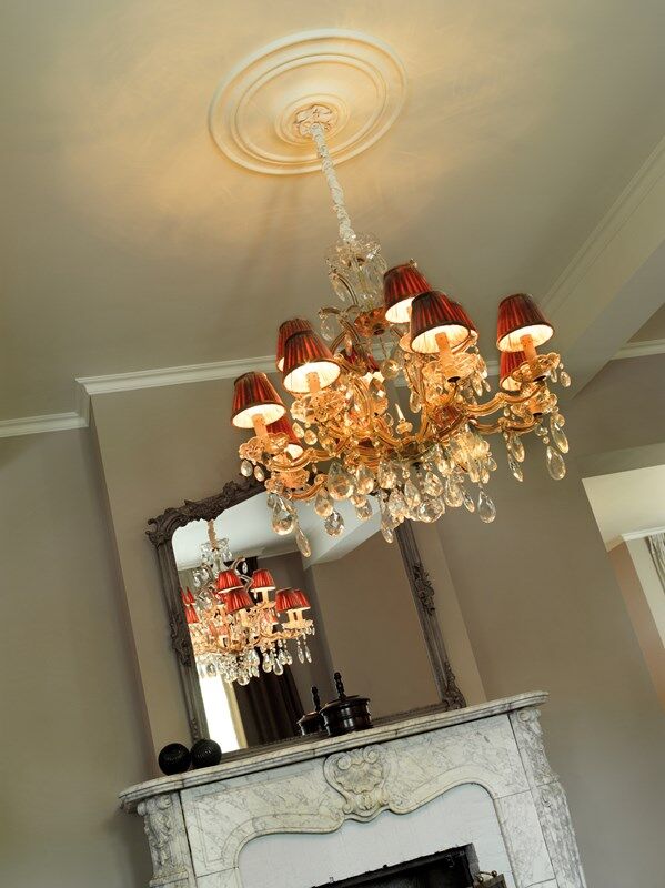 NMC 02 001447 crystal chandelier above marble fireplace with ornate mirror