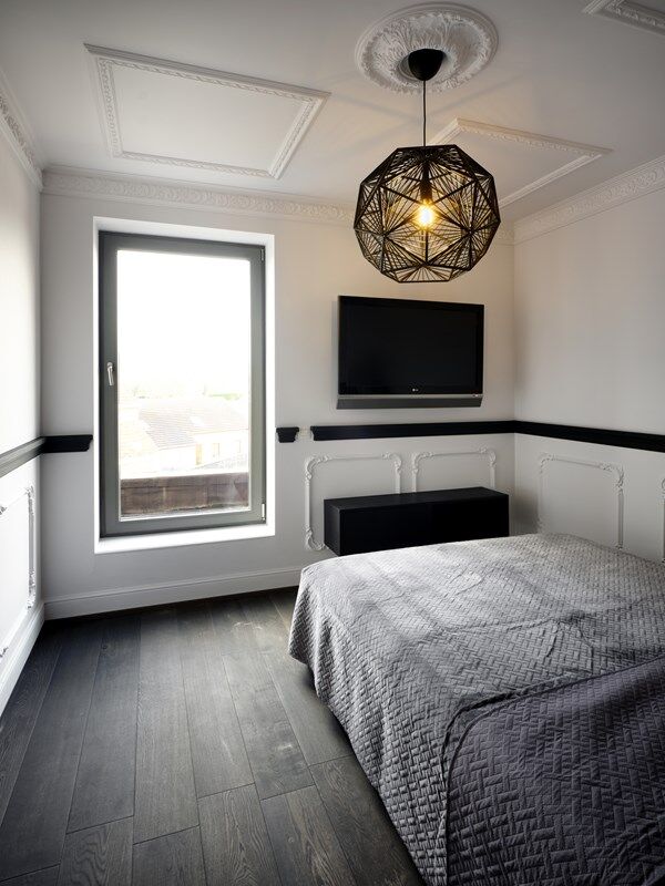 NMC 02 001963 panel moulding in a modern bedroom corner with pendant light and wall-mounted TV