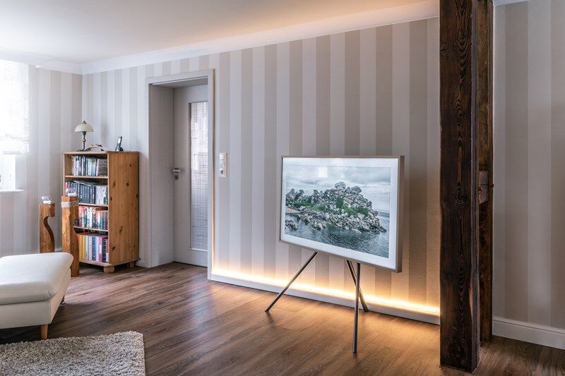 NMC 02 002788 coving in modern living room corner with striped wallpaper and wooden floor