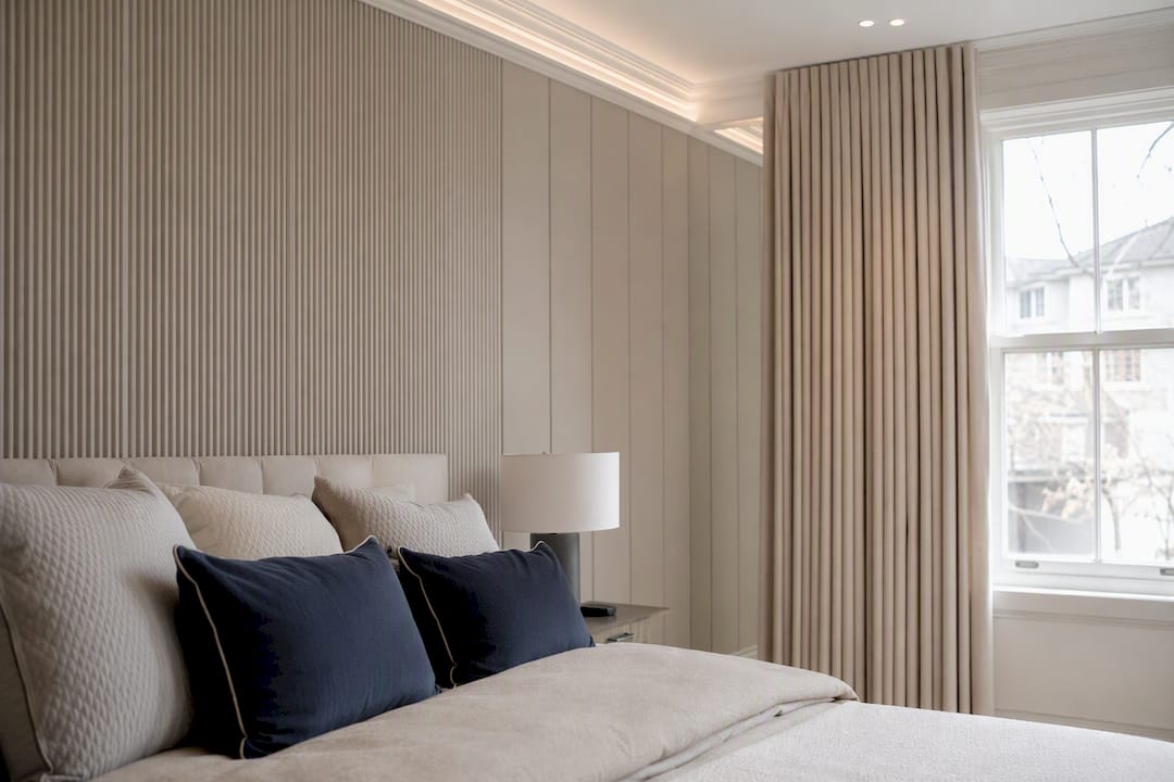 Luxurious bedroom with consistent fluted wall panelling