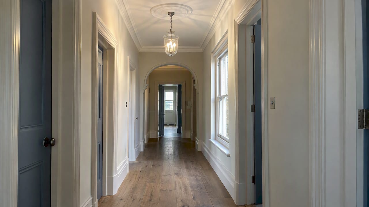 Coordinated coving and trim in a hallway