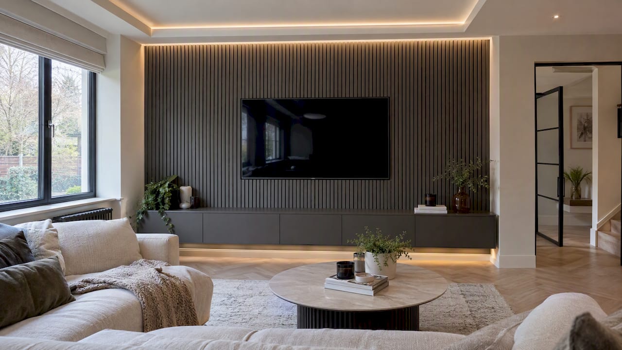 LED coving above a dark slatted media wall